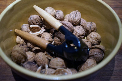 High angle view of nuts in bowl on table