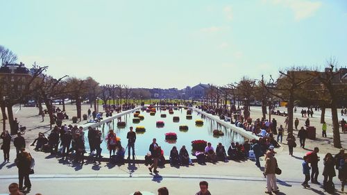 People enjoying fountain in park