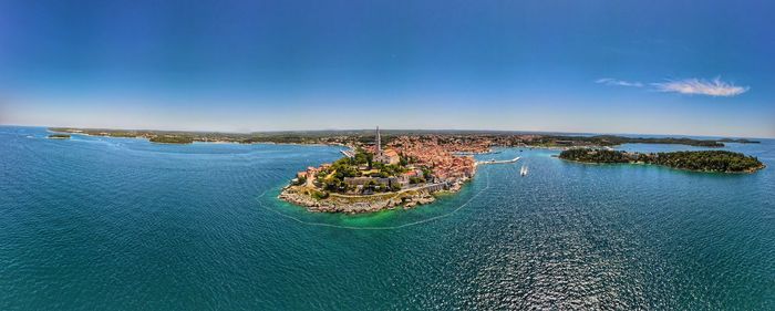 High angle view of bay against blue sky