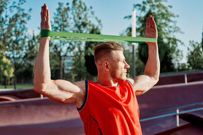 Rear view of woman exercising in gym