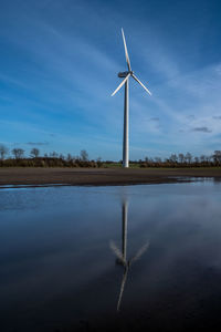 Windmill in landscape outside grenaa, denmark