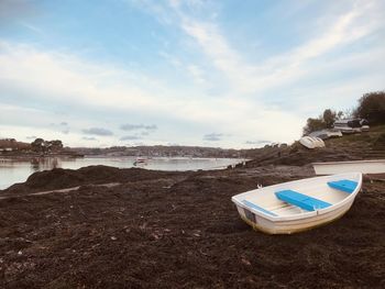 Blue and white dinghy at restronguet point. fal estuary in cornwall, uk.