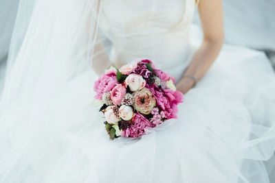 Close-up of woman holding bouquet