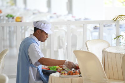 Man preparing food in restaurant
