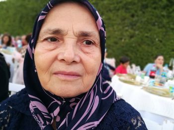 Close-up of mature woman looking away while wearing hijab
