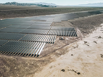 Renewable solar energy solar farm in the desert of southern nevada on a dry lake bed.