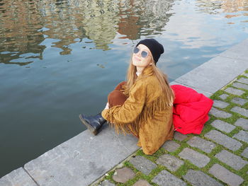 Woman sitting in water