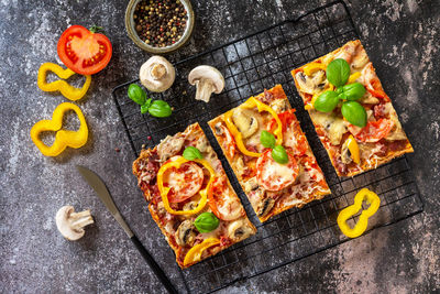 Homemade baking detroit-style pizza. large rectangular pepperoni pizza with mushrooms, salami. 