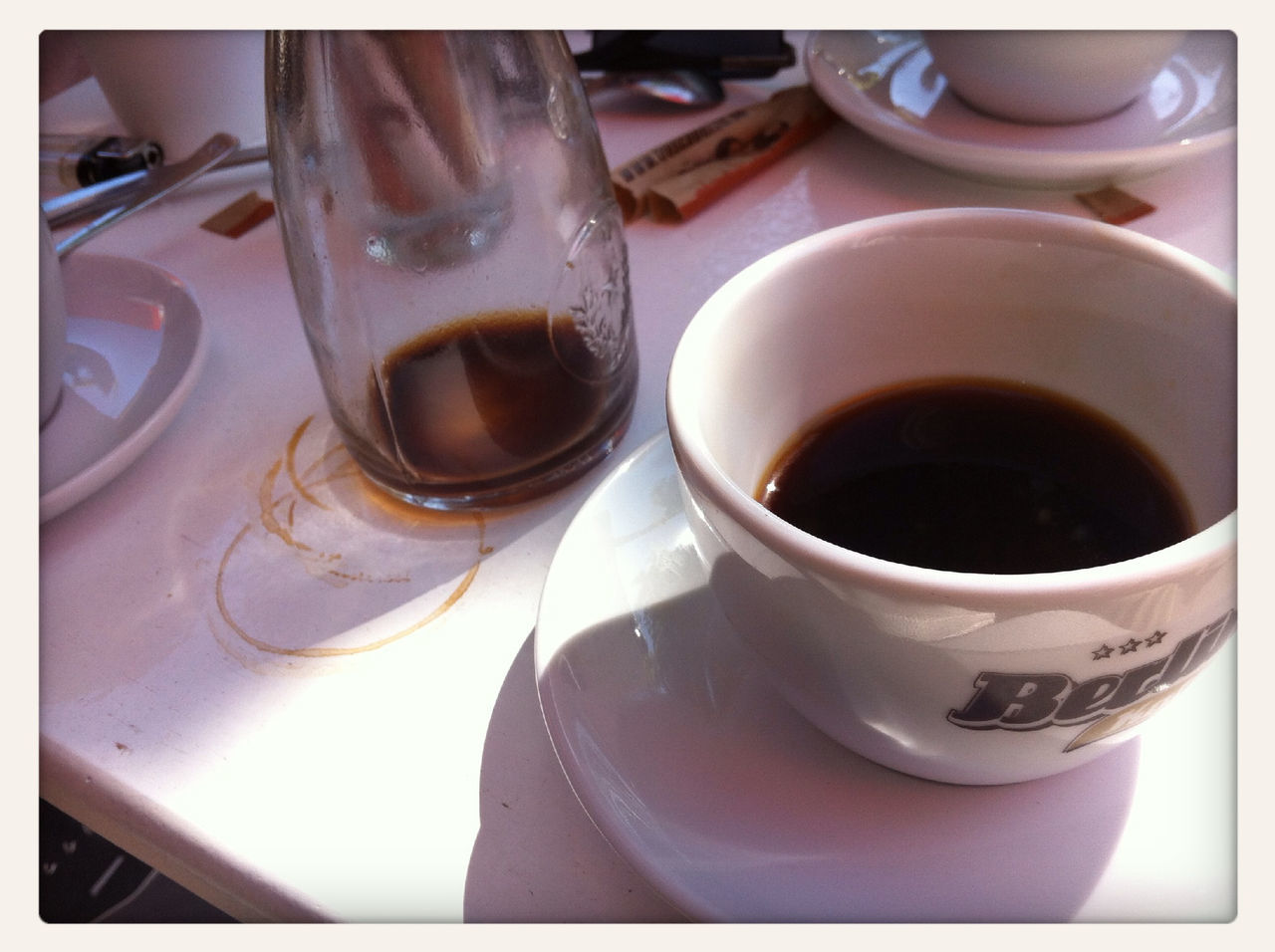 indoors, drink, coffee cup, food and drink, refreshment, transfer print, still life, coffee - drink, saucer, table, cup, coffee, close-up, auto post production filter, tea cup, spoon, freshness, no people, tea, high angle view