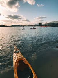 Boats sailing in sea against sky