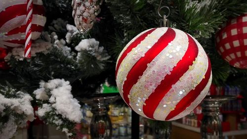 Close-up of christmas decorations hanging on tree