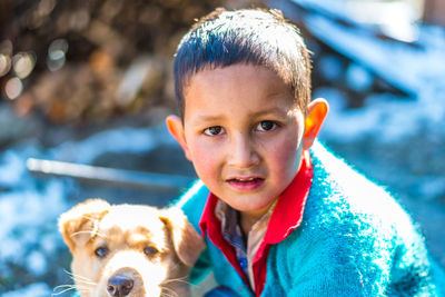 Portrait of boy with dog