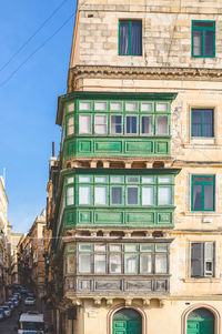 Low angle view of building against blue sky