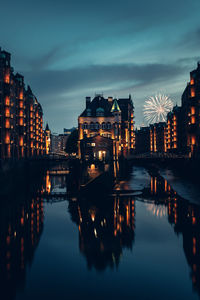 Illuminated buildings in city at night