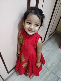 Portrait of smiling girl at home