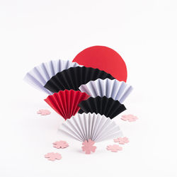 Close-up of umbrellas against white background