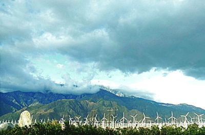 Scenic view of storm clouds over landscape