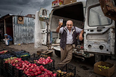 Portrait of man working at bus