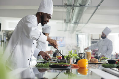 Chef preparing food in restaurant kitchen