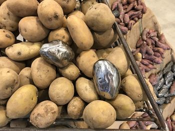 High angle view of onions for sale at market stall