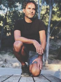 Young man sitting outdoors