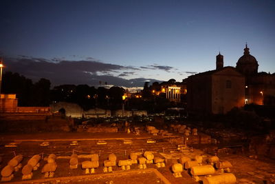 Illuminated temple against sky at night