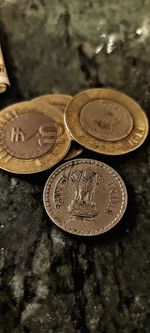 High angle view of coins on table