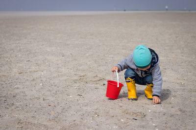 Boy with toy on beach