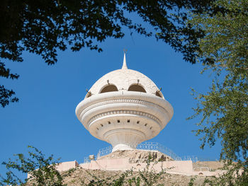 Low angle view of building against blue sky