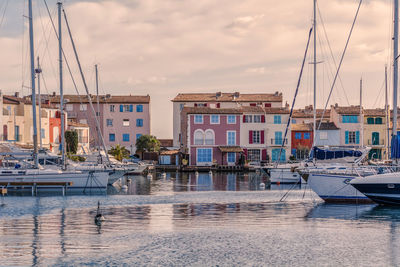 Boats moored at harbor