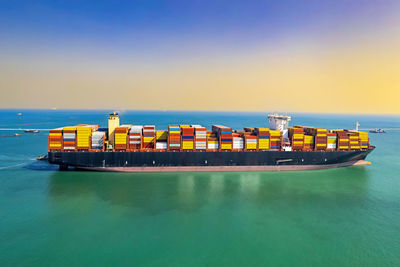 Container cargo ship at industrial and international transportation by cargo ship container.