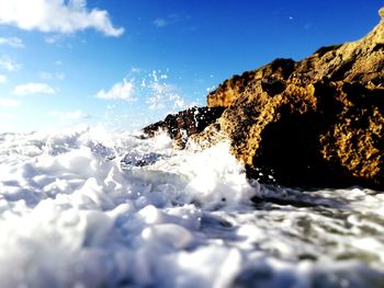 Scenic view of sea against blue sky