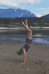 Full length of a man jumping in lake