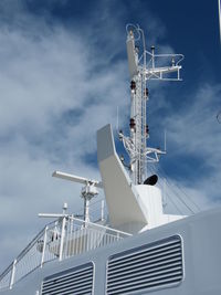 Low angle view of communications tower against sky