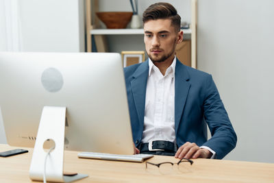 Young businessman working at office