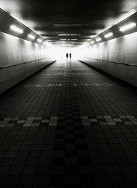 People walking in tunnel