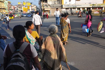 People crossing road in city