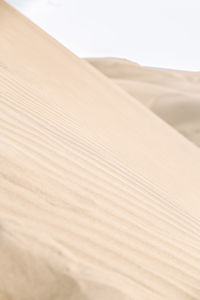 Sand dunes in desert against sky