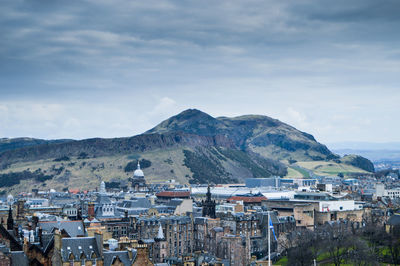 Residential district against cloudy sky