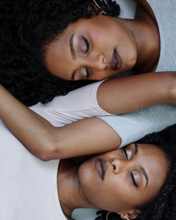 Close up two african woman next to each other portrait