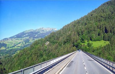 Country road leading towards mountains