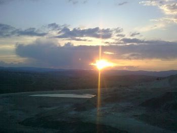 Scenic view of landscape against sky during sunset