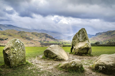 Panoramic shot of rocks on land against sky