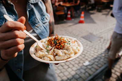 Midsection of people having food