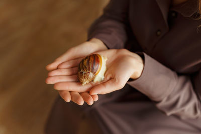 Midsection of person holding ice cream