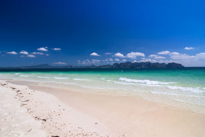 View of beach against cloudy sky