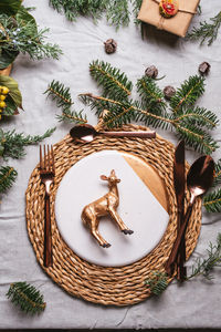 Directly above shot of place mat by christmas decoration on table