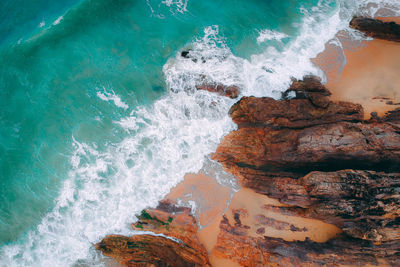 Waves splashing on rock