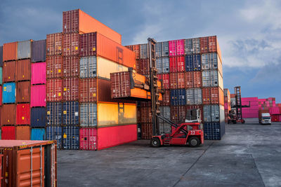 Stack of traffic on pier against sky