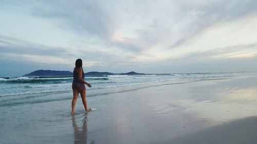 Woman standing on beach